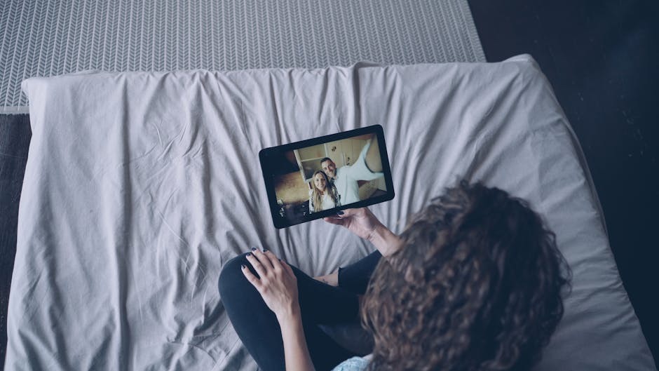 Person on a tablet video call with a couple, demonstrating live verification of swinger profiles before meeting